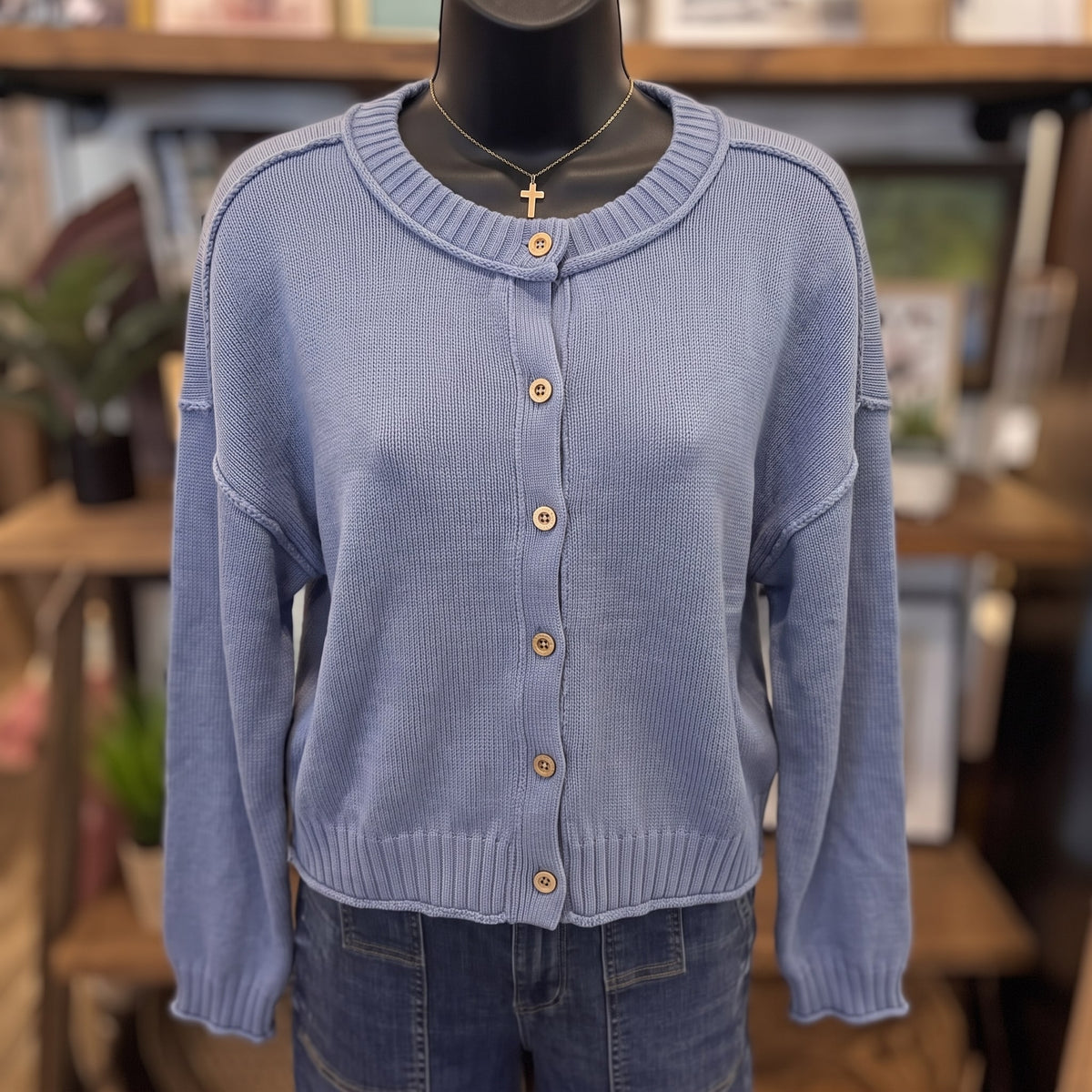 Raw Edge Exposed Seam Button Down Knit Cardigan | Dusty Blue — Front view on mannequin