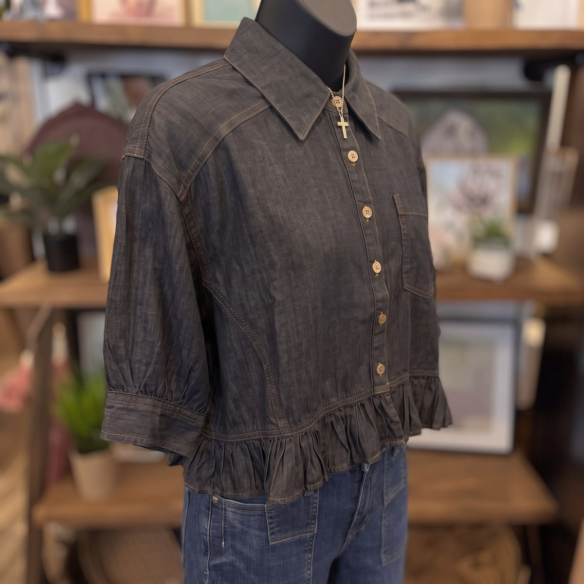 Button Down Ruffled Hem Blouse | Black Denim — Angled view on mannequin