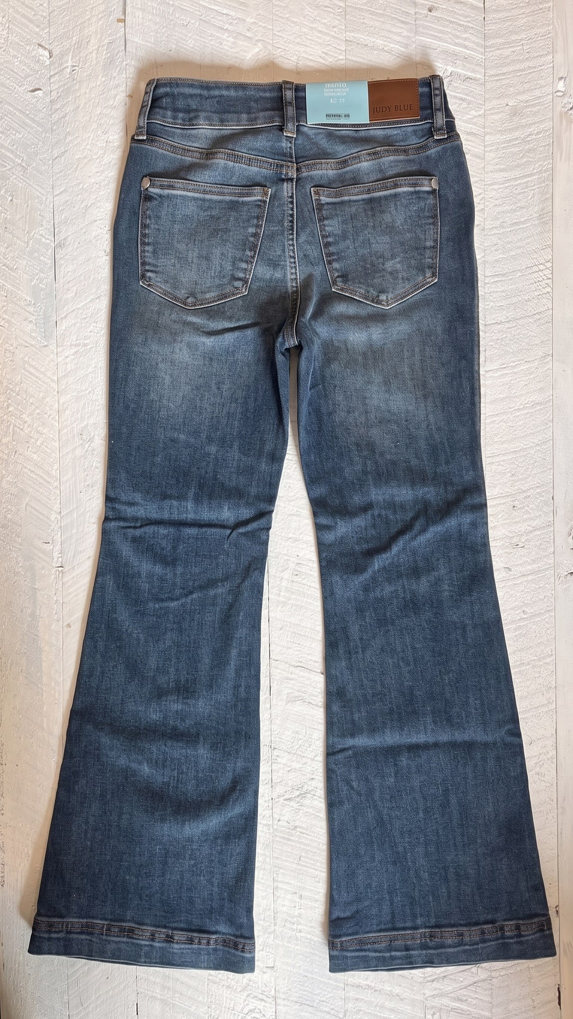 Judy Blue Petite Flare Jeans | Medium Wash — Back view