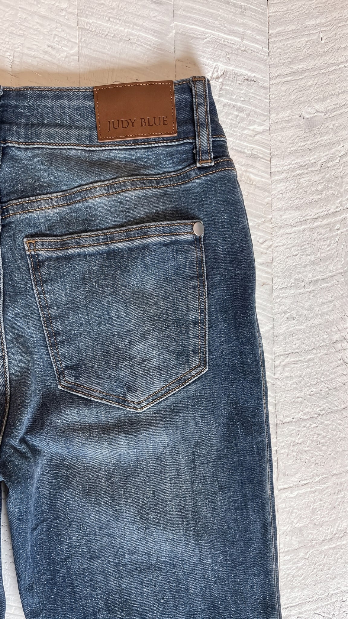 Judy Blue Petite Flare Jeans | Medium Wash — Back pocket detail