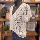 Crochet Short Sleeve Button Down Crop Cardigan | Natural — Angled view on mannequin