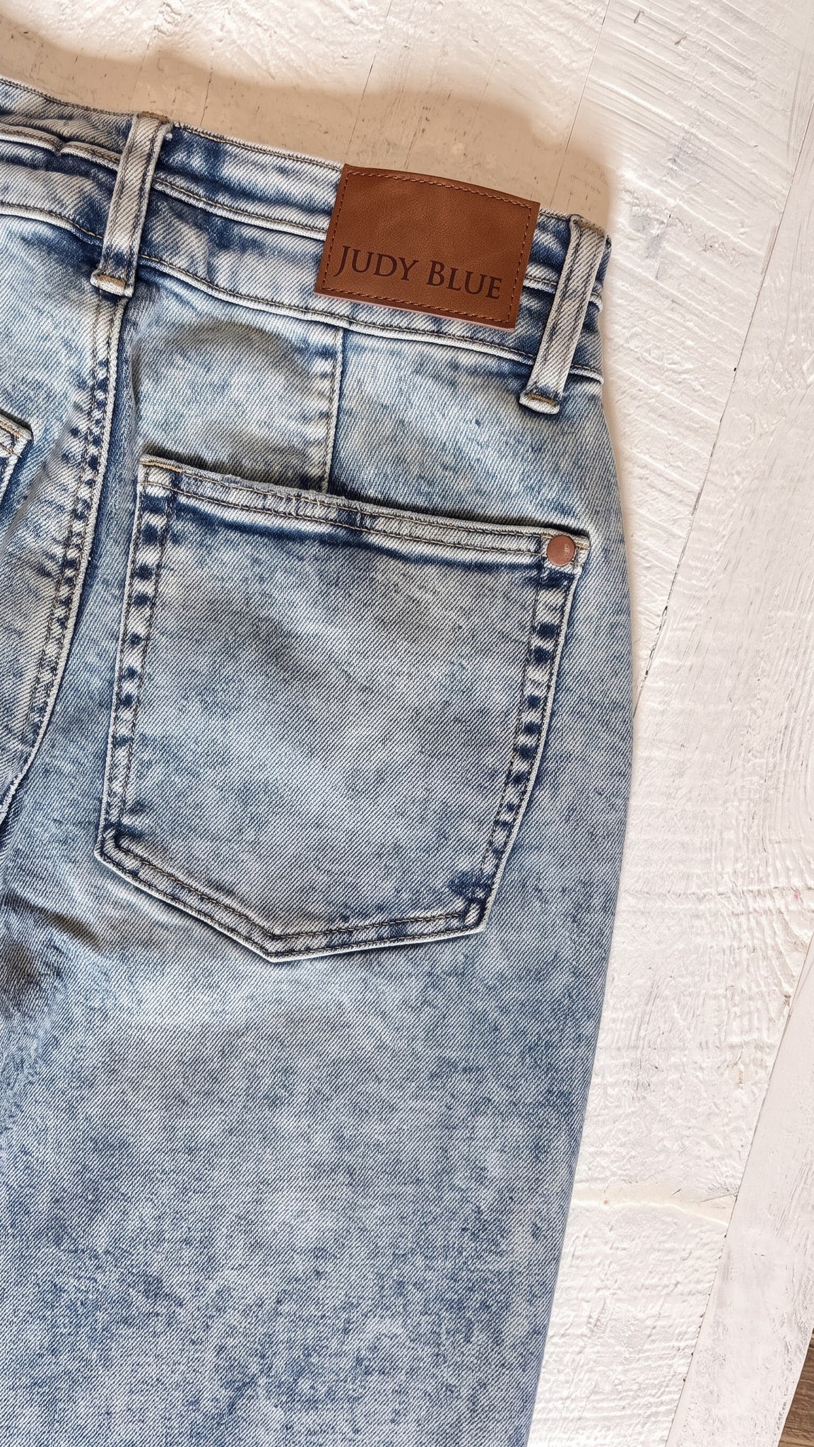 Judy Blue High Waisted Marlow Arc Leg Double Waistband Jeans | Light — Back pocket detail