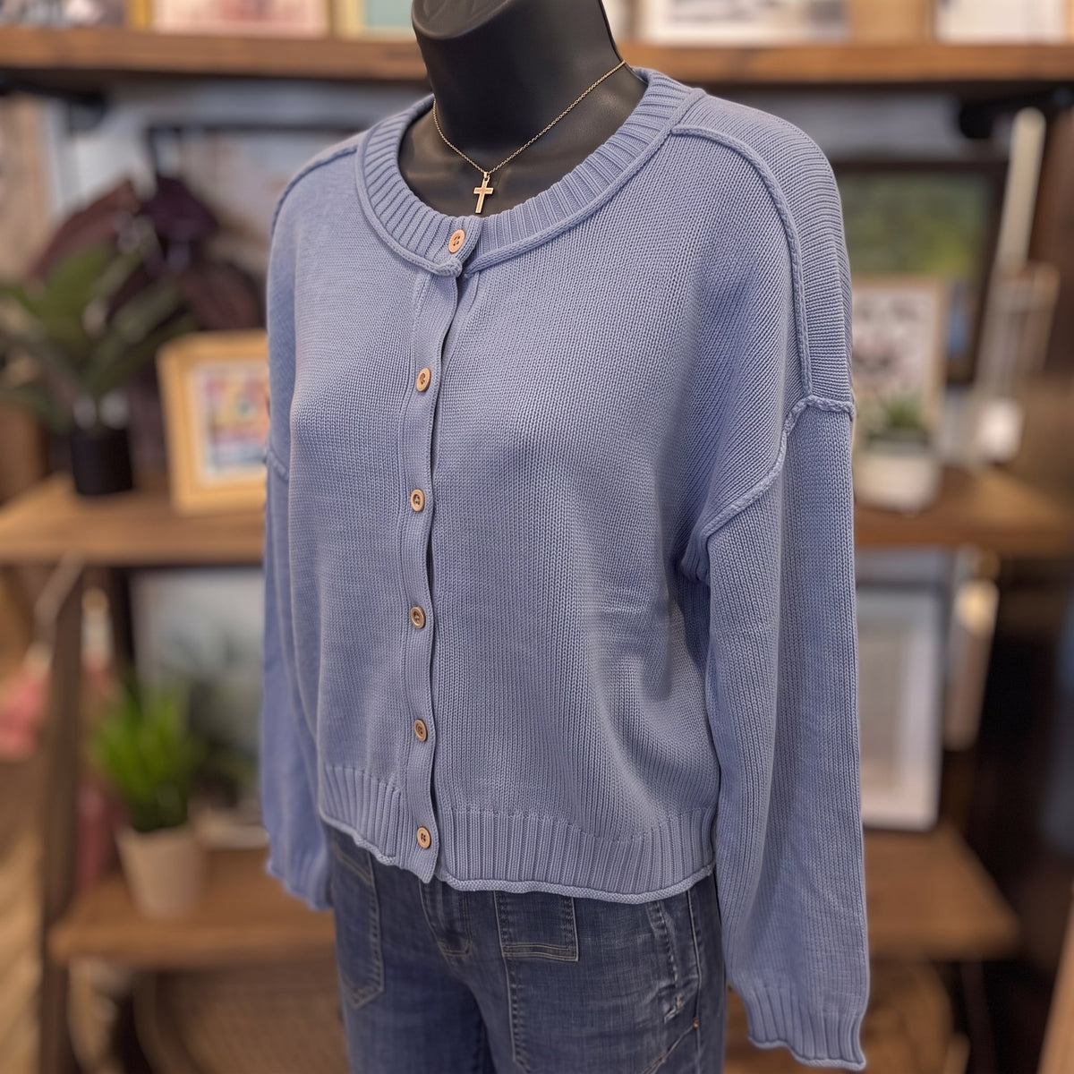 Raw Edge Exposed Seam Button Down Knit Cardigan | Dusty Blue — Angled view on mannequin