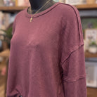 Exposed Seam Detail Long Sleeve Knit Top | Maroon — Fabric and detail close-up