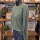 Washed Crew Neck Long Sleeve Knit Top | Dusty Green — Angled view on mannequin