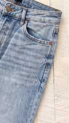 Judy Blue Mid Rise Rigid Magic Straight | Medium Wash — Front pocket detail