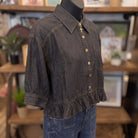 Button Down Ruffled Hem Blouse | Black Denim — Angled view on mannequin